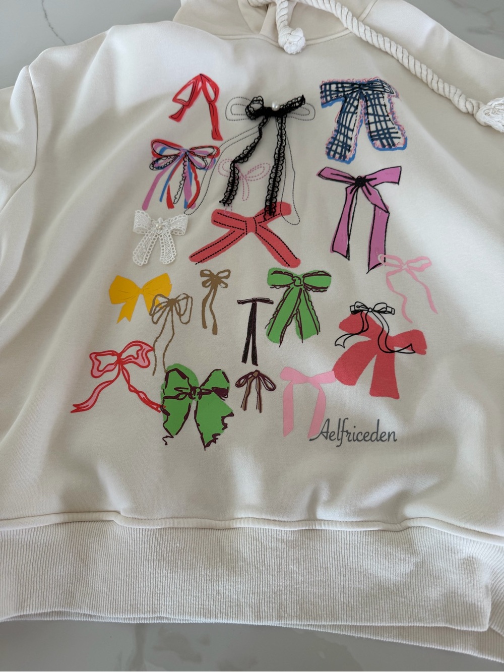 Aelfric Eden Cream Hoodie with Multicolor Bow Motif